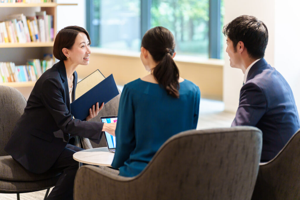 Lawyer talking to two Property Conveyancing clients